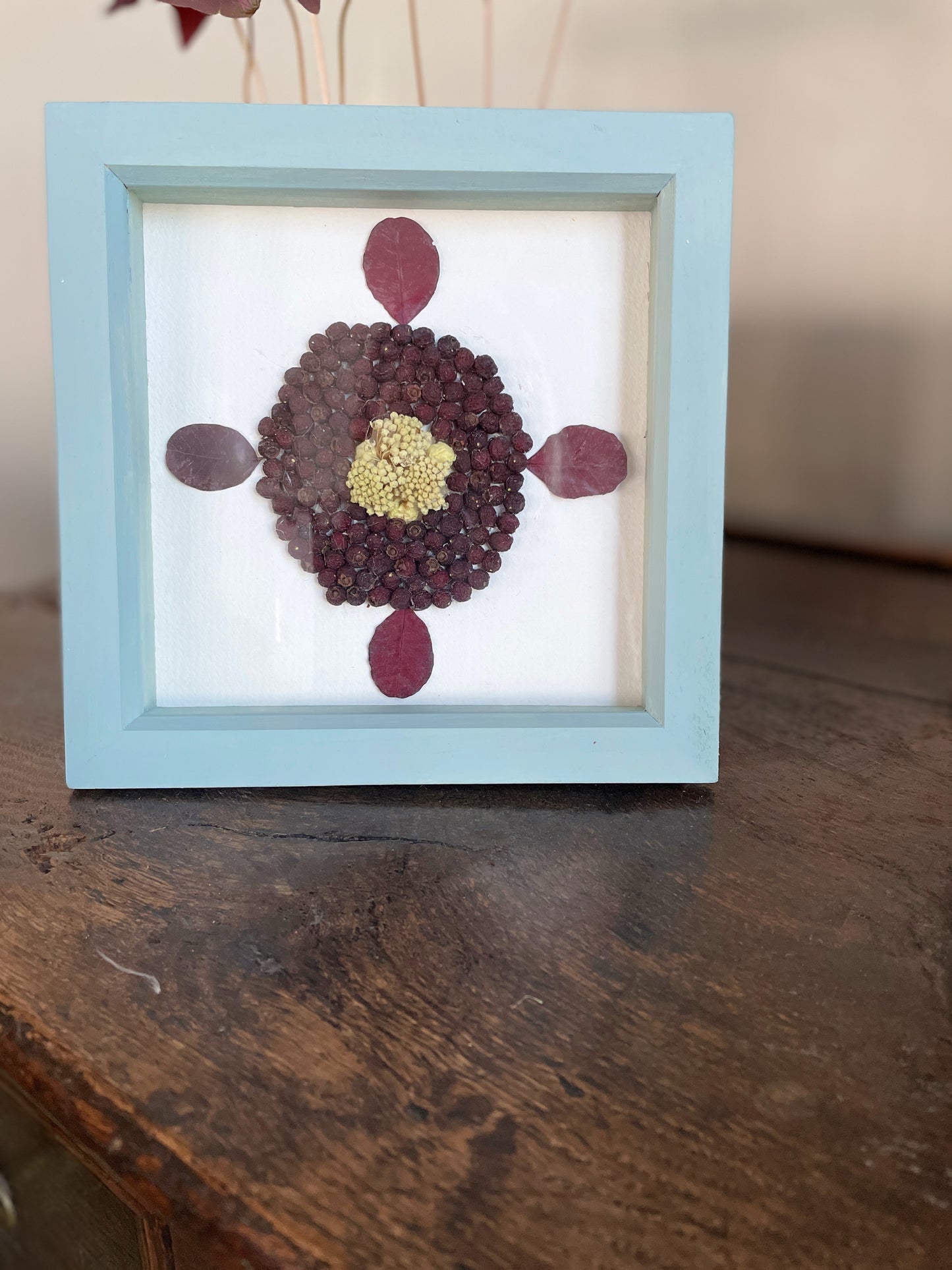 Small box frame with Fatsia and berries