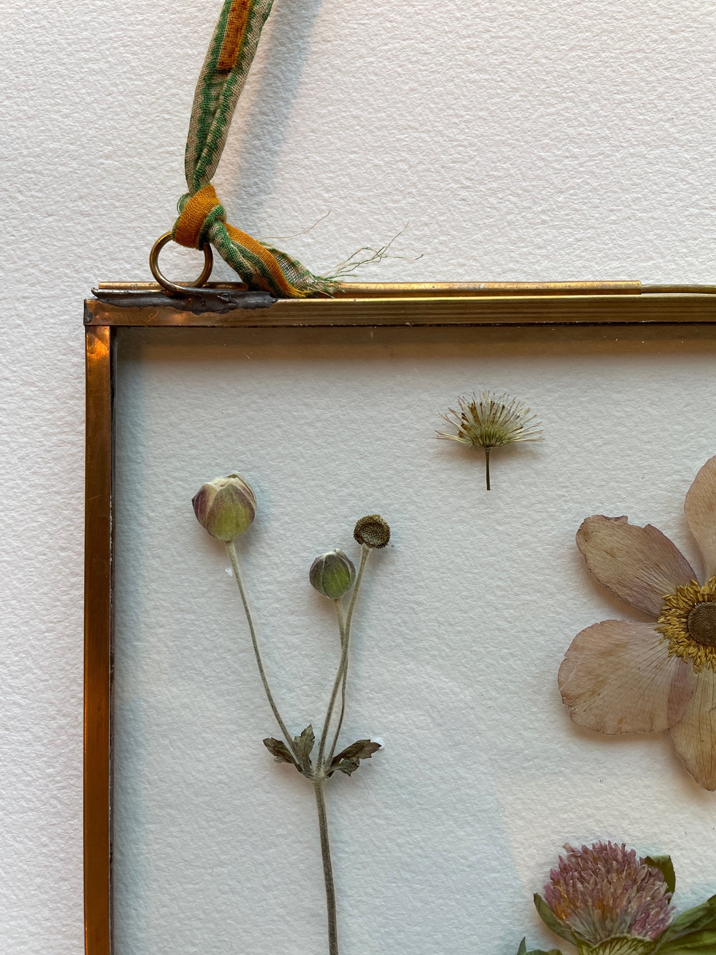Brass glass frame with soft pink flowers