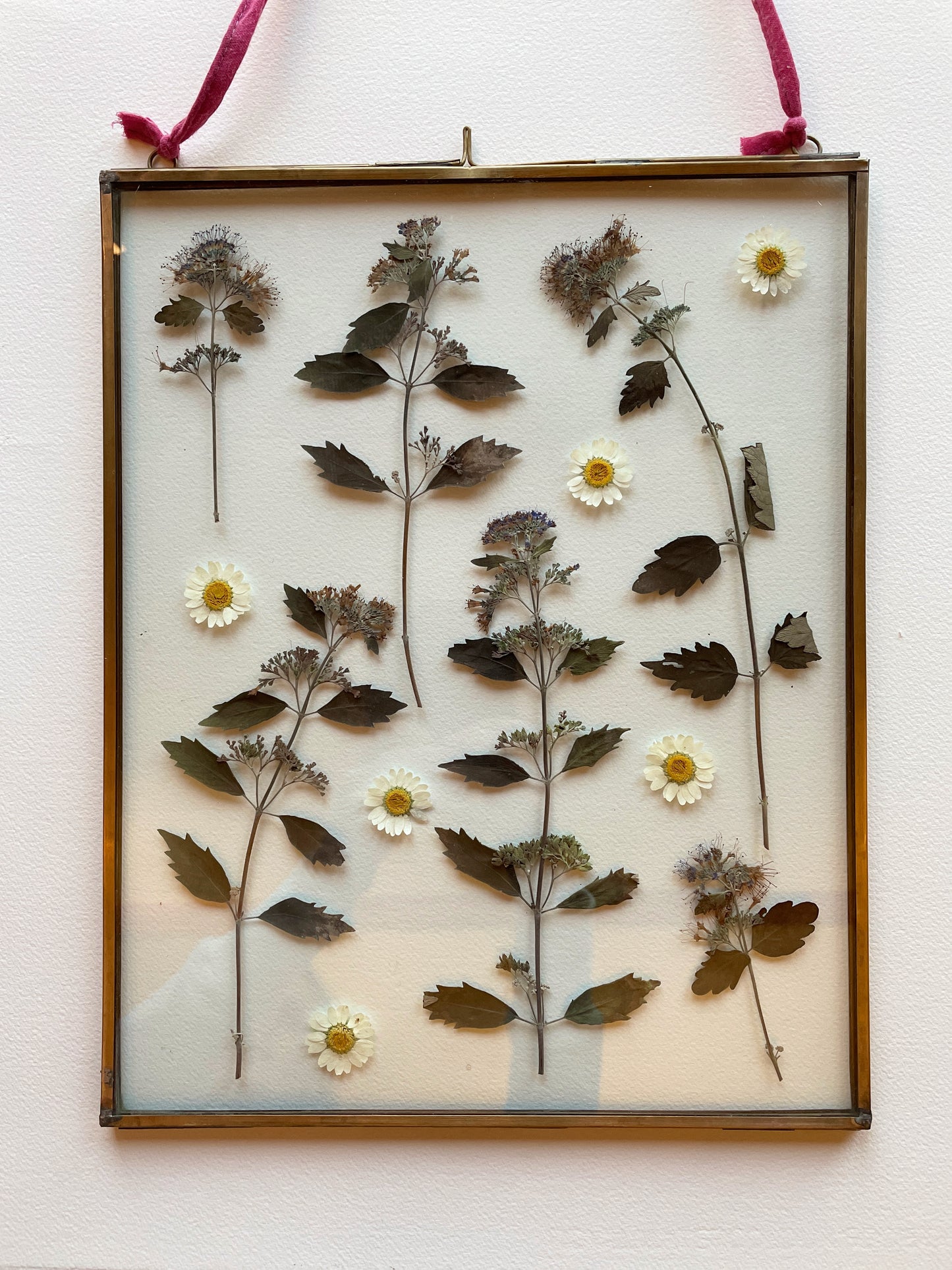 Brass glass frame with silvery blue tones