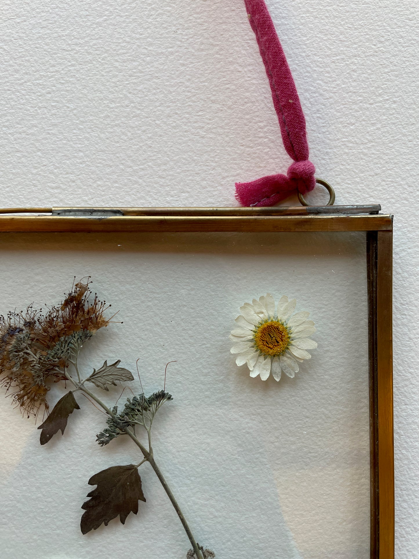 Brass glass frame with silvery blue tones