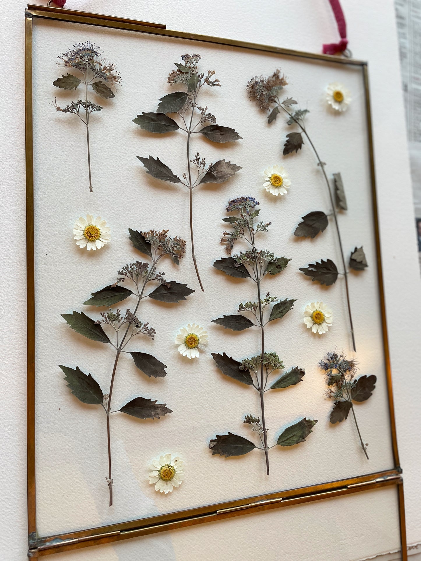 Brass glass frame with silvery blue tones