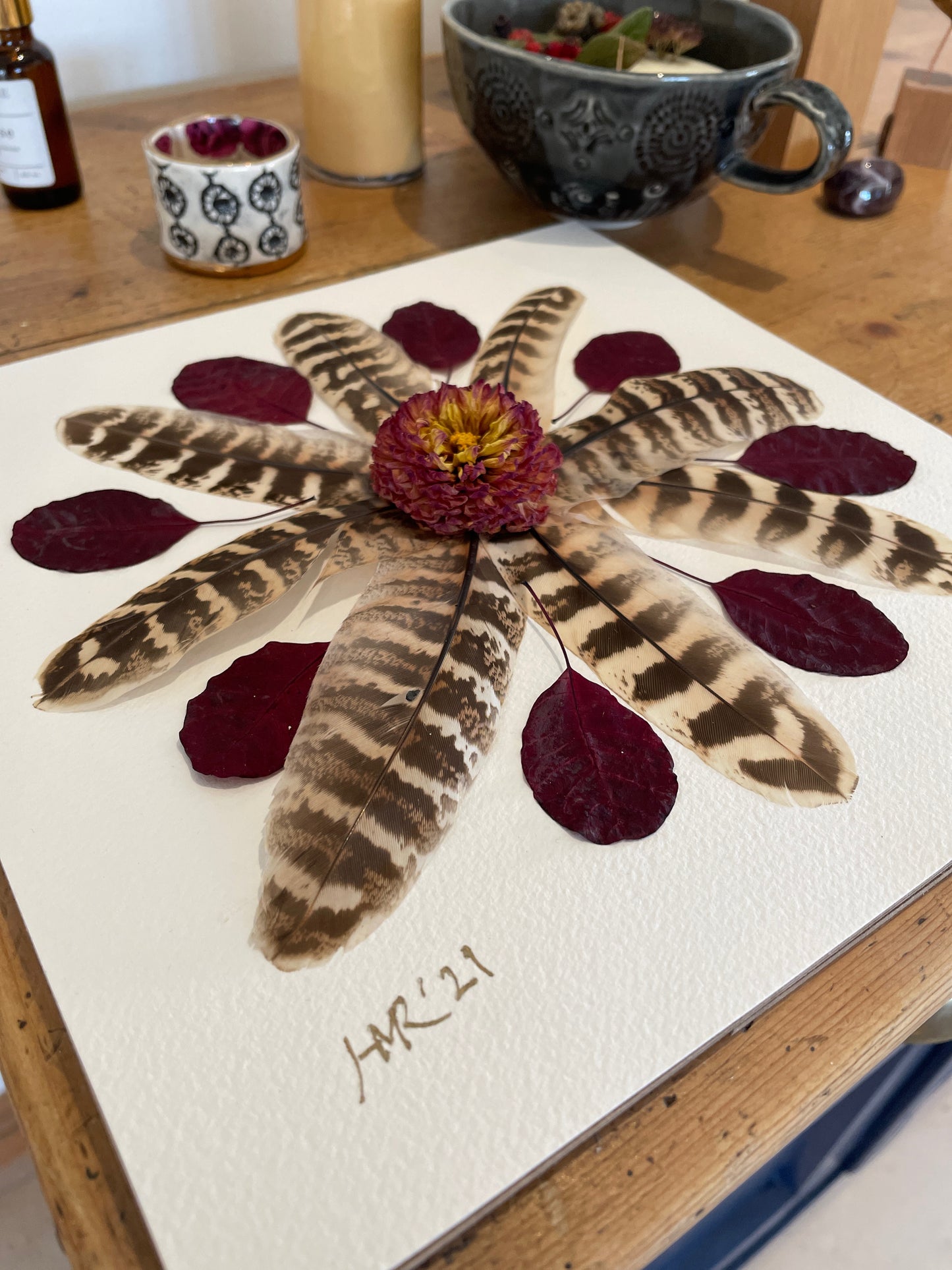 Box frame with pheasant feathers and red leaves