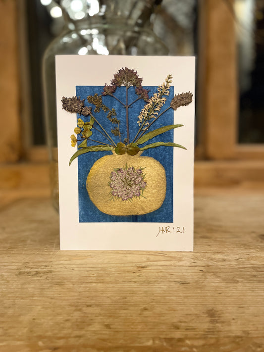 Painted gold vase with pressed flowers