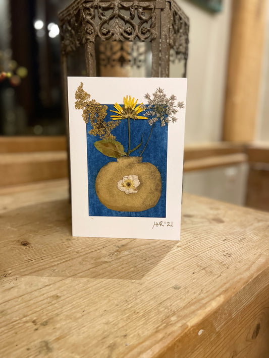 Gold painted vase greeting card with a yellow dandelion