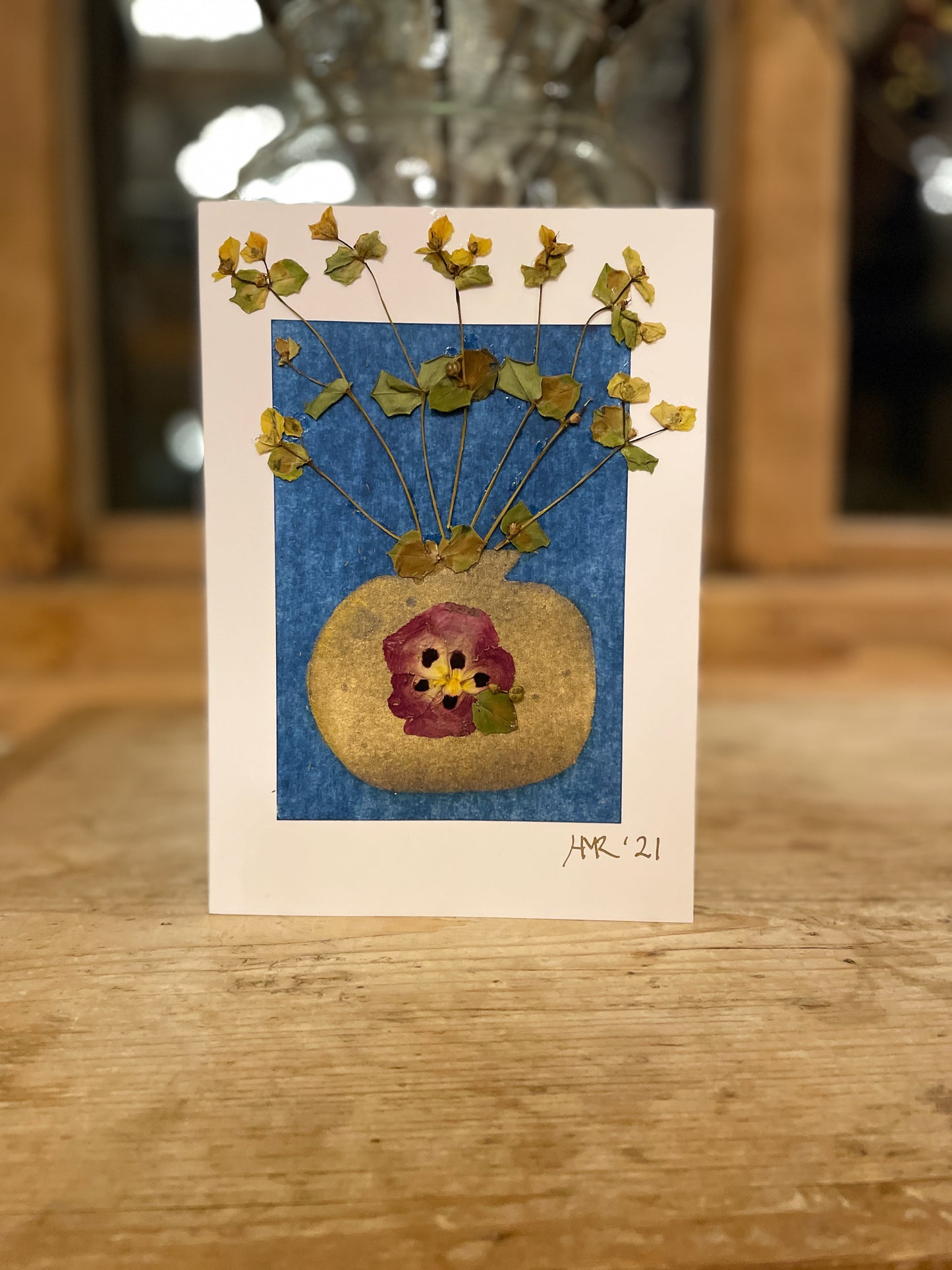 Gold vase with pressed flowers greeting card