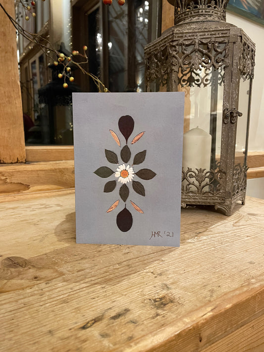 Daisy and green leaf greeting card