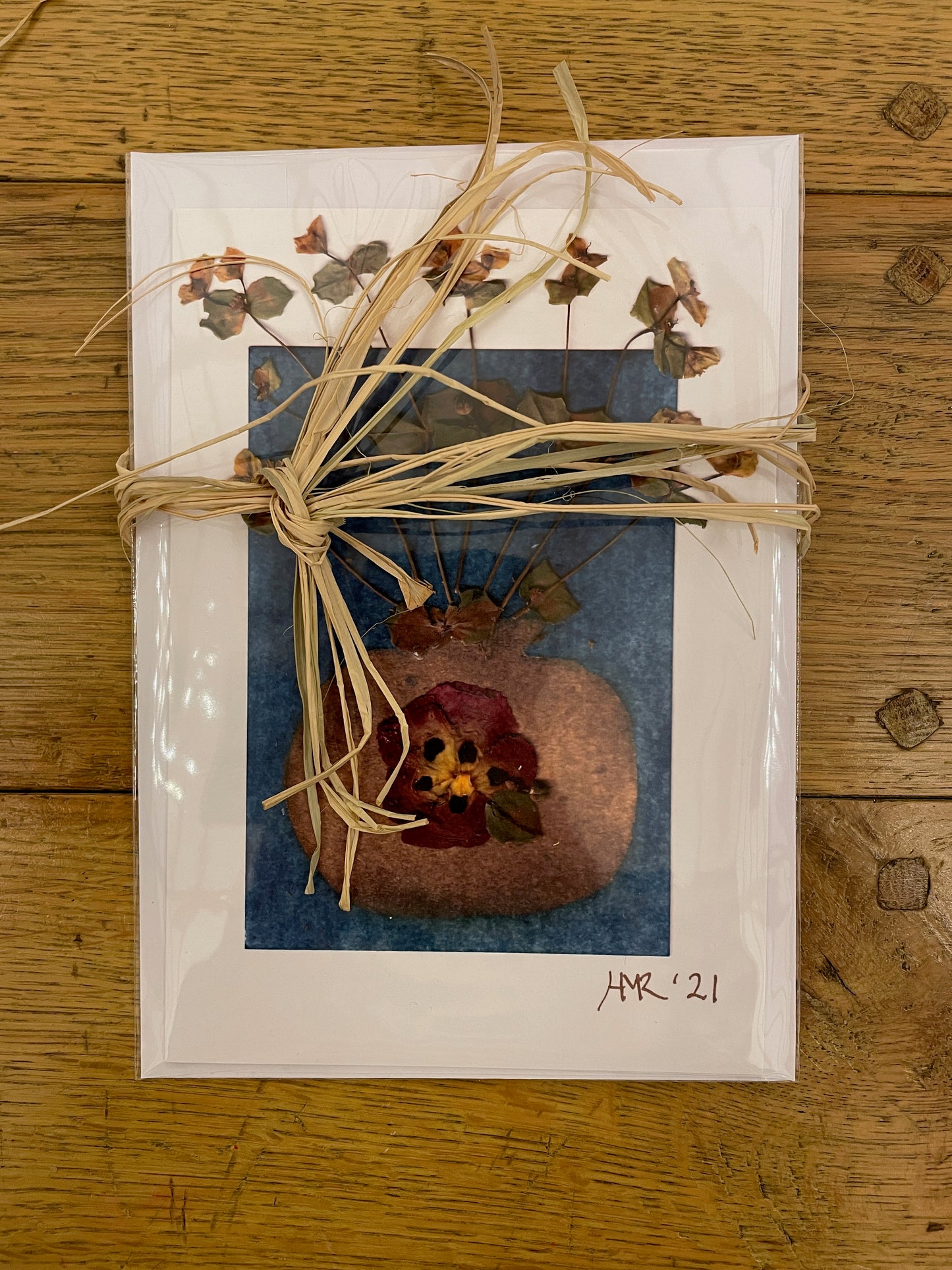Gold vase with pressed flowers greeting card