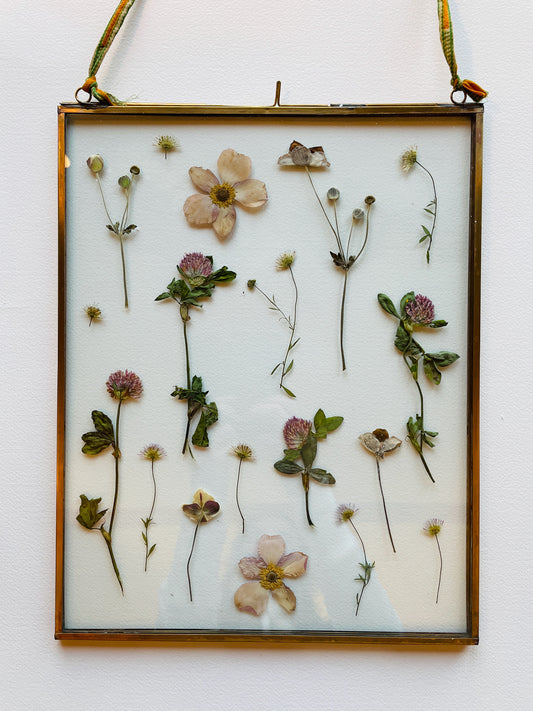 Brass glass frame with soft pink flowers