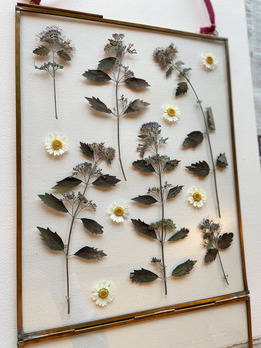 Brass glass frame with silvery blue tones
