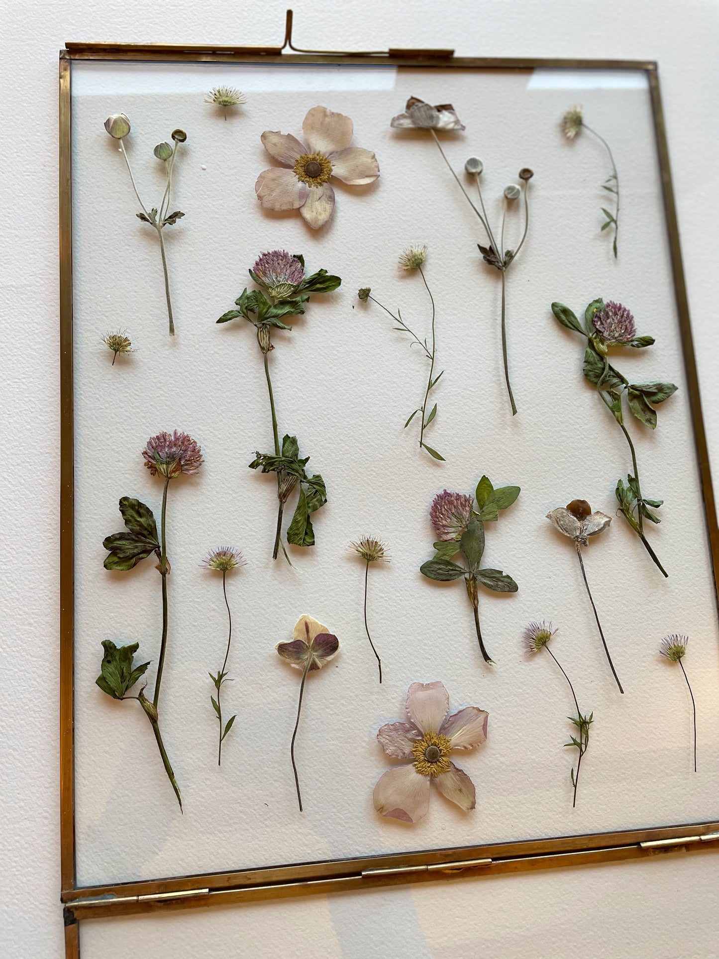 Brass glass frame with soft pink flowers